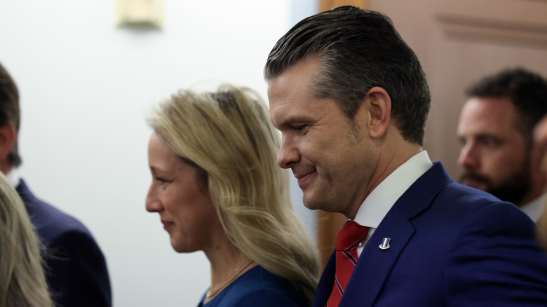 President-elect Donald Trump's nominee for Secretary of Defense Pete Hegseth and wife Jennifer Rauchet walking into his Senate Armed Services Committee confirmation hearing on Capitol Hill