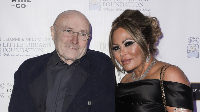 Phil Collins and Orianne Cevey pose together in 2019