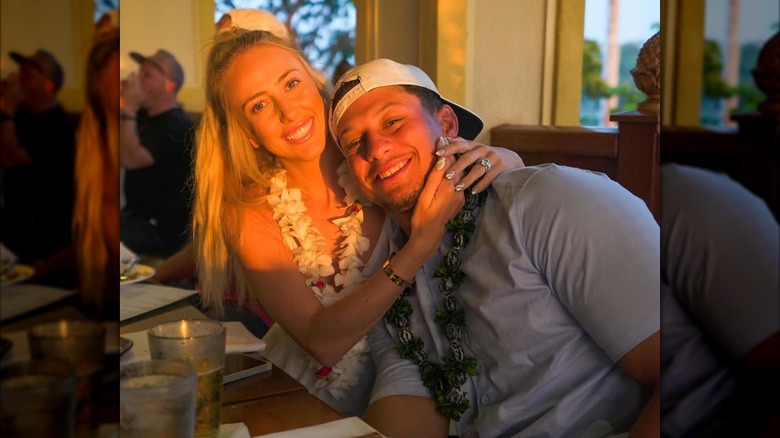 Brittany Mahomes hugging Patrick Mahomes close
