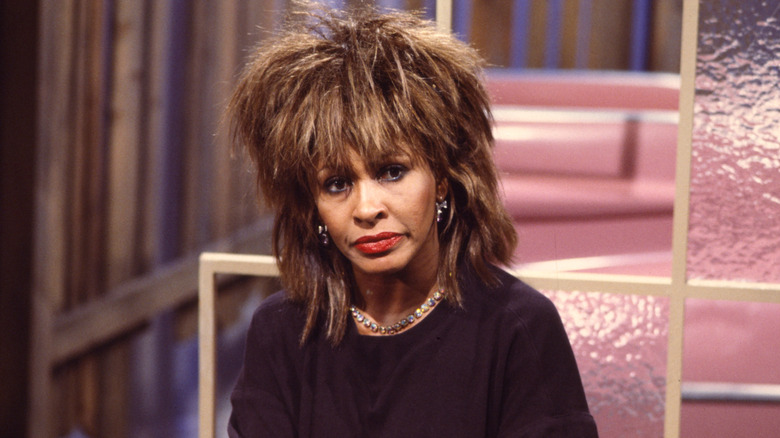 Tina Turner with a serious facial expression during an interview.