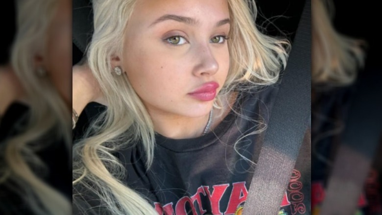 Alabama Barker posing in her car