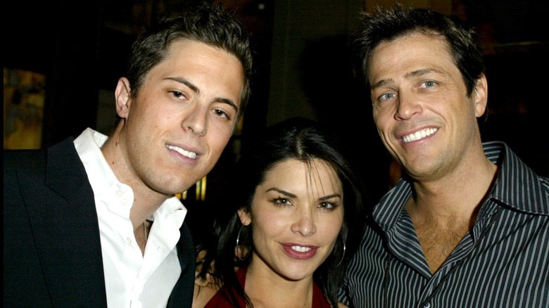 Lauren Sánchez Bezos smiling between Harry Morton and Patrick Whitesell