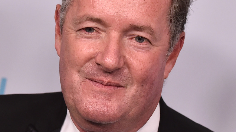 Piers Morgan posing for the cameras