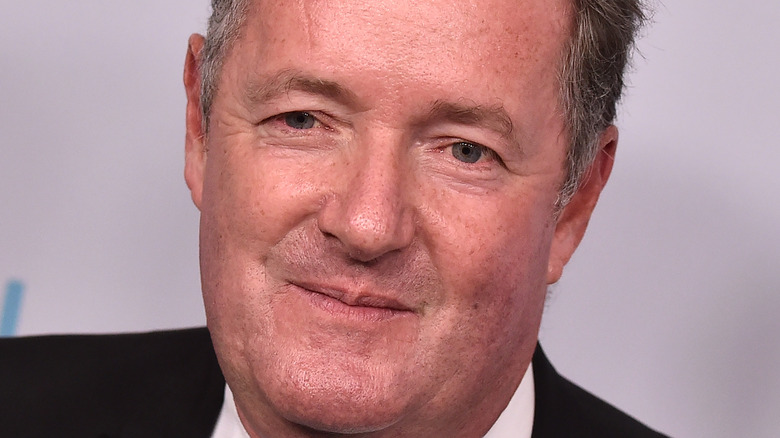 Piers Morgan grins on the red carpet