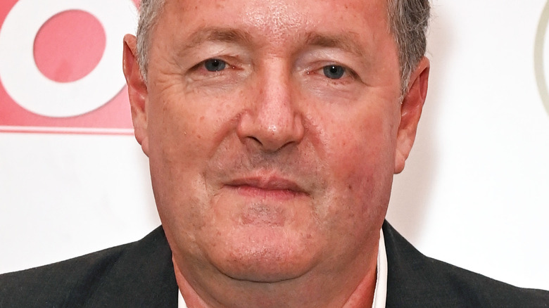 Piers Morgan posing on the red carpet