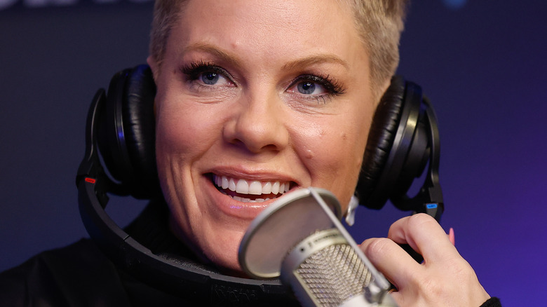 Pink smiling with headphones