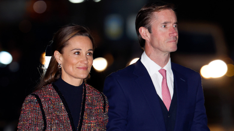 Pippa Middleton and James Matthews walk together in December 2023