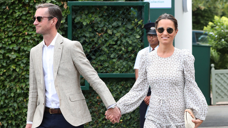 Pippa MIddleton and James Matthews walk hand-in-hand in 2018
