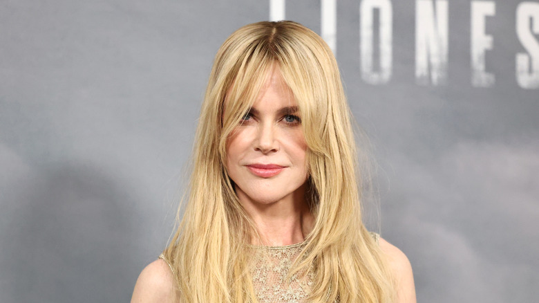 Nicole Kidman posing on the red carpet while sporting wispy bangs