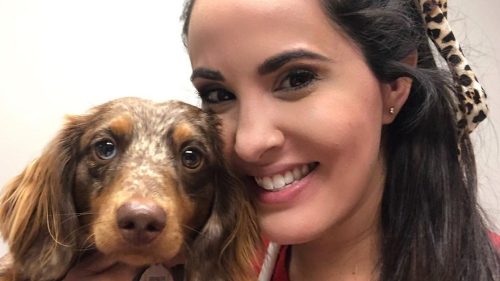 Dr. Jackie Dueñas holding a dog