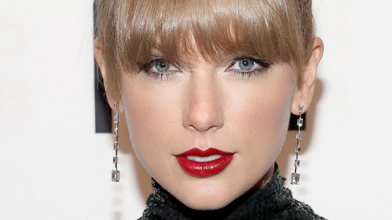 Taylor Swift bangs red lipstick
