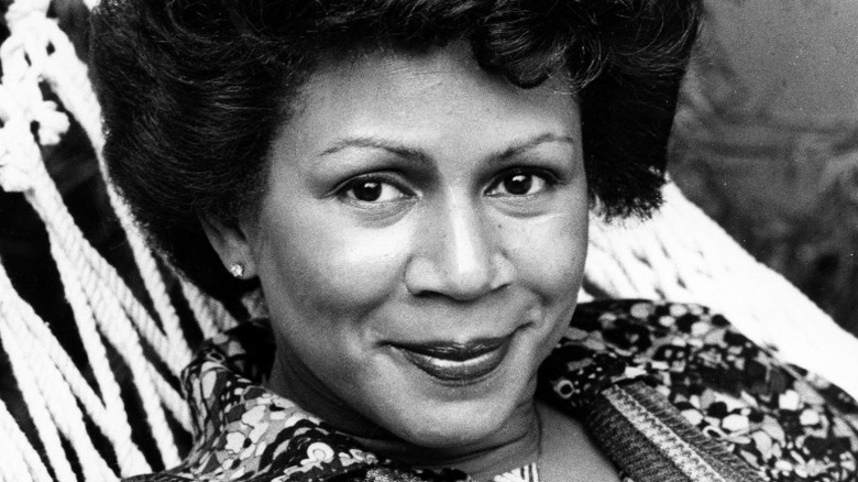 Minnie Riperton smiling in hammock