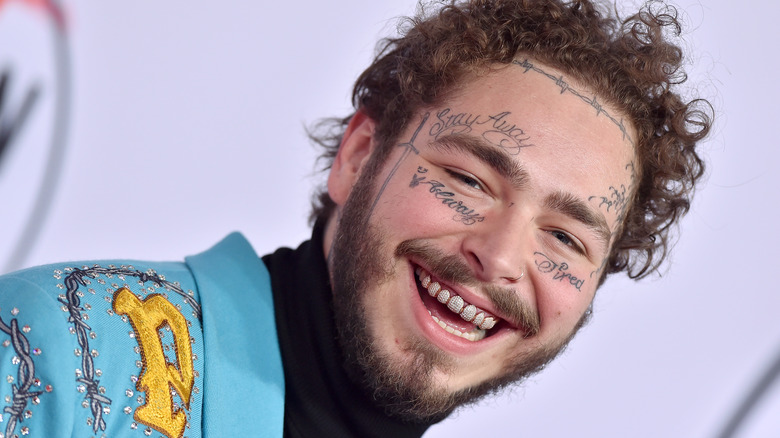 Post Malone, smiling