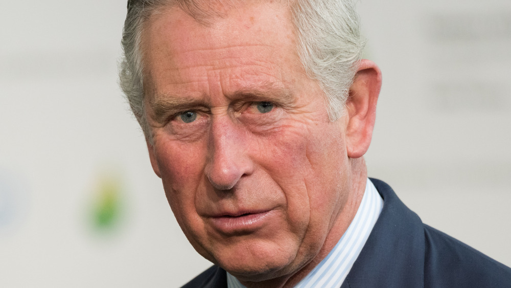 Prince Charles with a serious expression