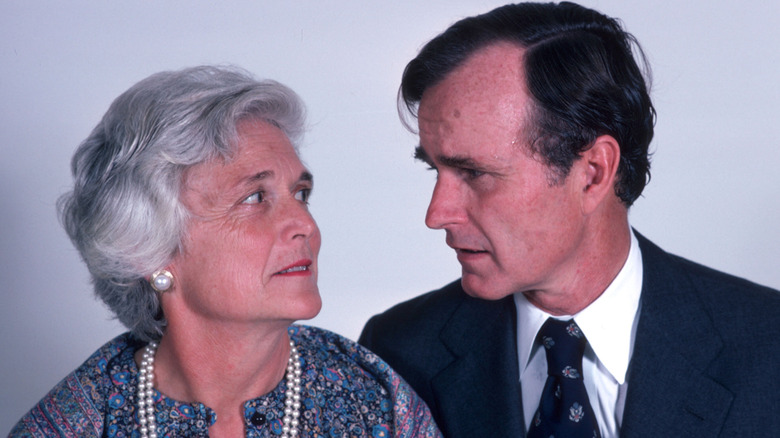 George H.W. Bush and Barbara Bush looking at each other