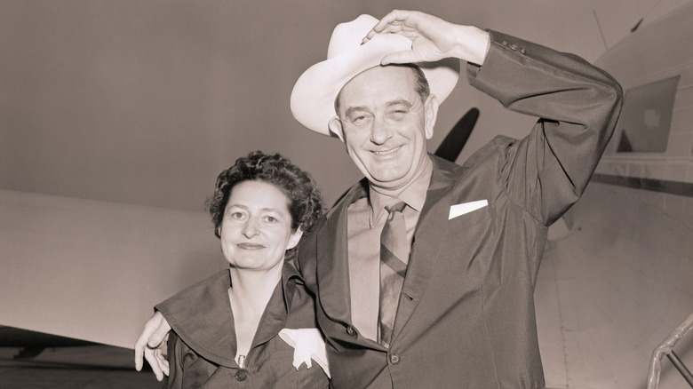 Lyndon B. Johnson and his wife leaving their Texas home