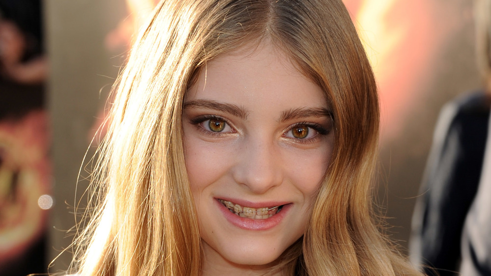 Willow Shields smiling on a red carpet