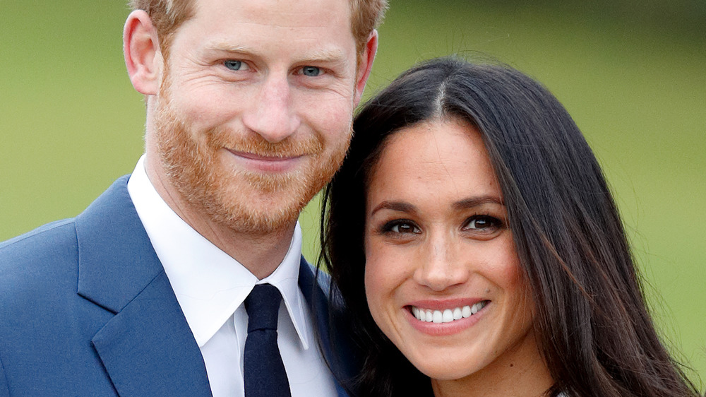 Prince Harry and Meghan Markle smiling 