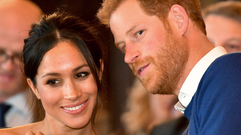 Prince Harry and Meghan Markle smiling