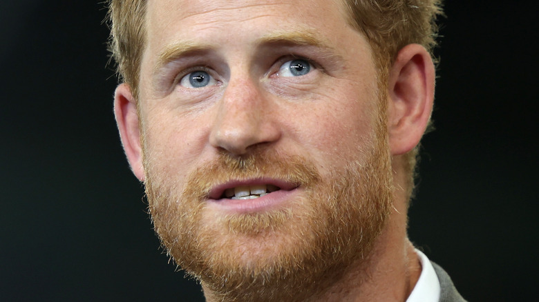 Prince Harry looking on