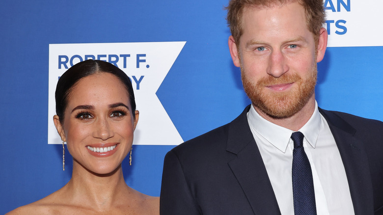 Prince Harry and Meghan Markle smiling