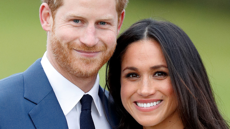 Prince Harry and Meghan Markle smiling