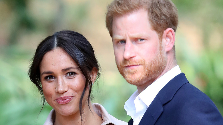 Prince Harry and Meghan Markle outside