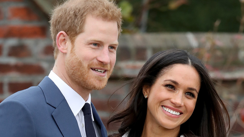 Prince Harry and Meghan Markle smiling