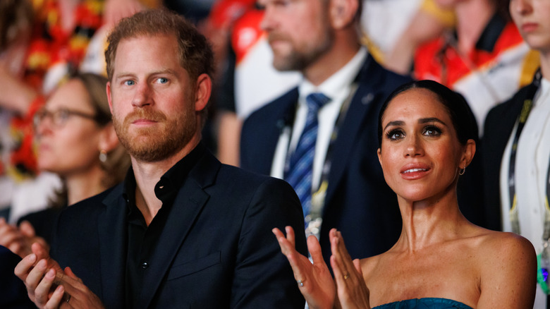 Prince Harry Meghan Markle glum