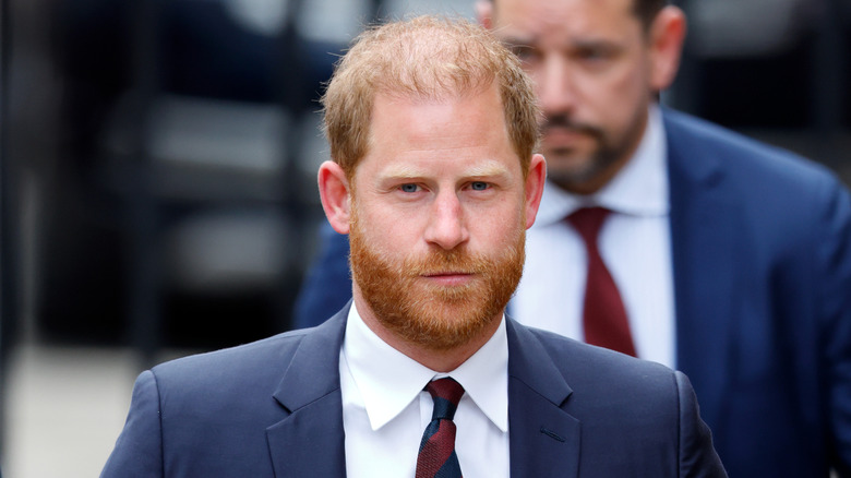 Prince Harry beard looking glum