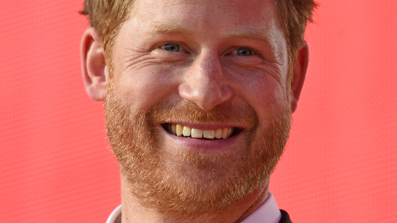 Prince Harry smiling onstage