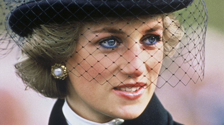 Princess Diana wearing black hat with veil