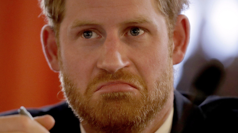 Prince Harry frowns