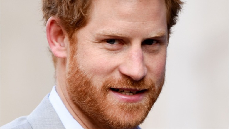 Prince Harry baring teeth