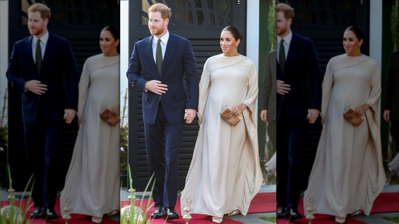 Prince Harry and Meghan Markle holding hands and smiling in Rabat, Morocco.