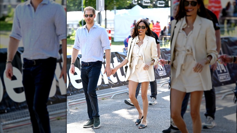 Prince Harry and Meghan Markle holding hands and walking outside while wearing sunglasses.