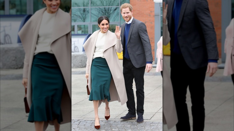 Prince Harry and Meghan Markle waving and smiling outside a building in Belfast, Northern Ireland.