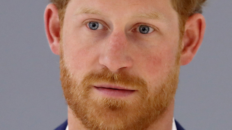 Prince Harry with a neutral expression