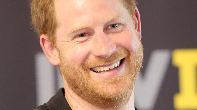Prince Harry smiling after playing table tennis