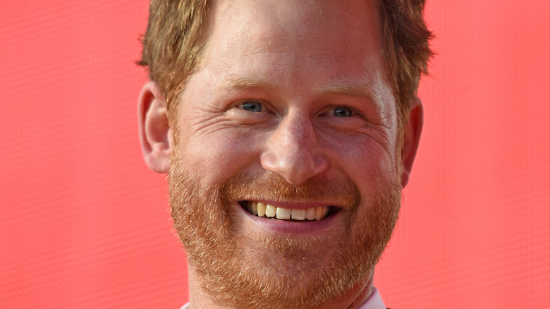 Prince Harry with red background