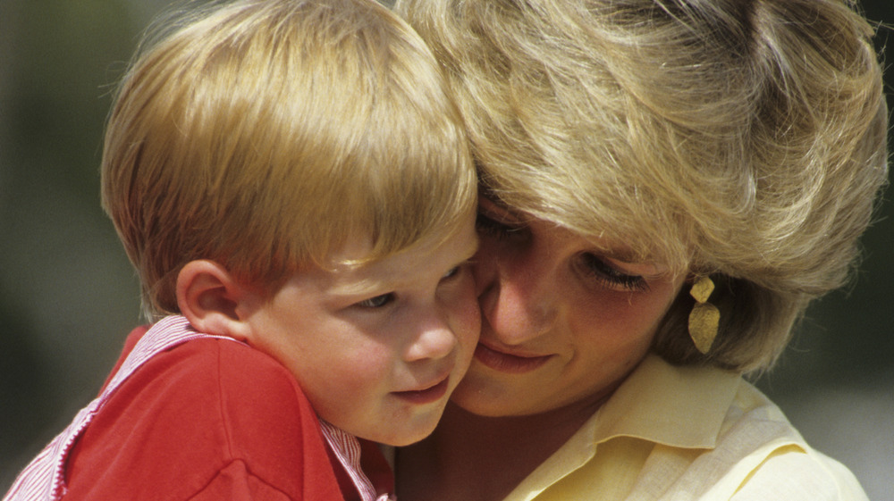 Princess Diana holding Prince Harry as a child