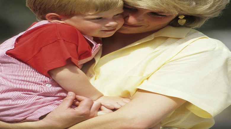 Princess Diana holding Prince Harry as a child