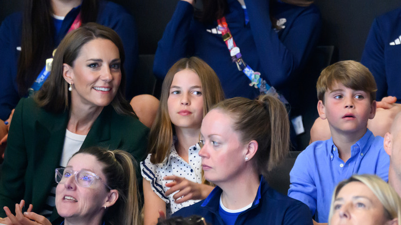 Kate Middleton, Princess Charlotte and Prince Louis watching the Commonwealth Games