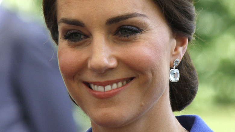 Kate Middleton smiling with hair back