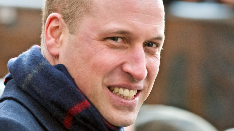 Prince William smiling in scarf