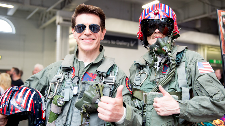 Tom cruise dressed as top gun maverick with cosplayer