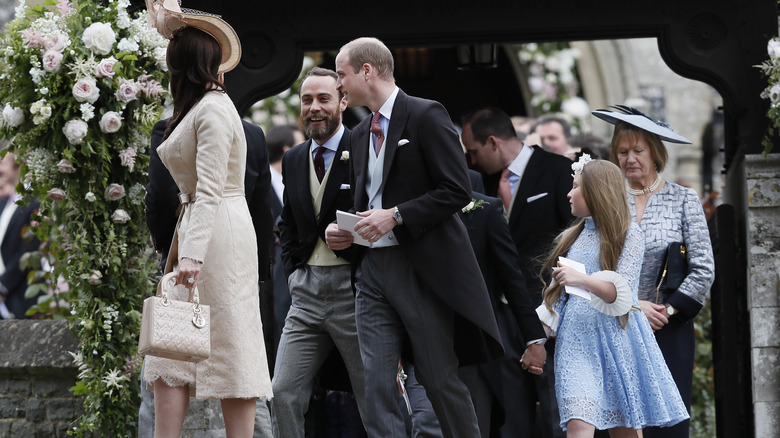 James Middleton walks with William