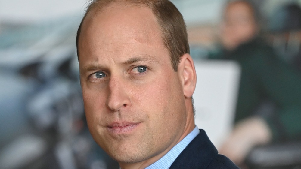 Prince William looks somber during a public outing