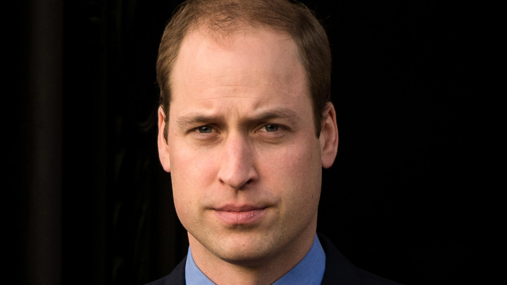 Prince William posing for a photo