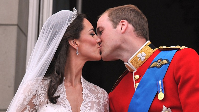 Prince William, Duke of Cambridge and Catherine, Duchess of Cambridge kissing on the balcony